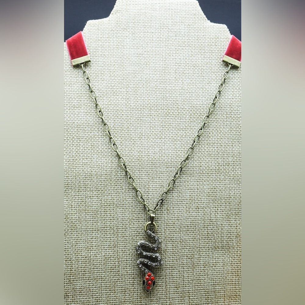 Snake eye. Brass snake pendant.